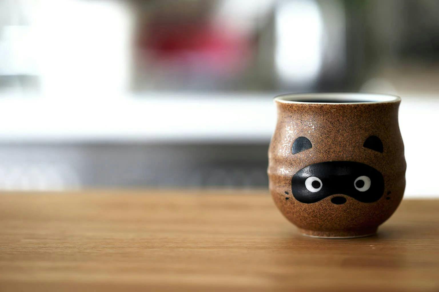 Tanuki are believed to bring good fortune. Depictions of the creatures can be found all over Japan, like this cup!