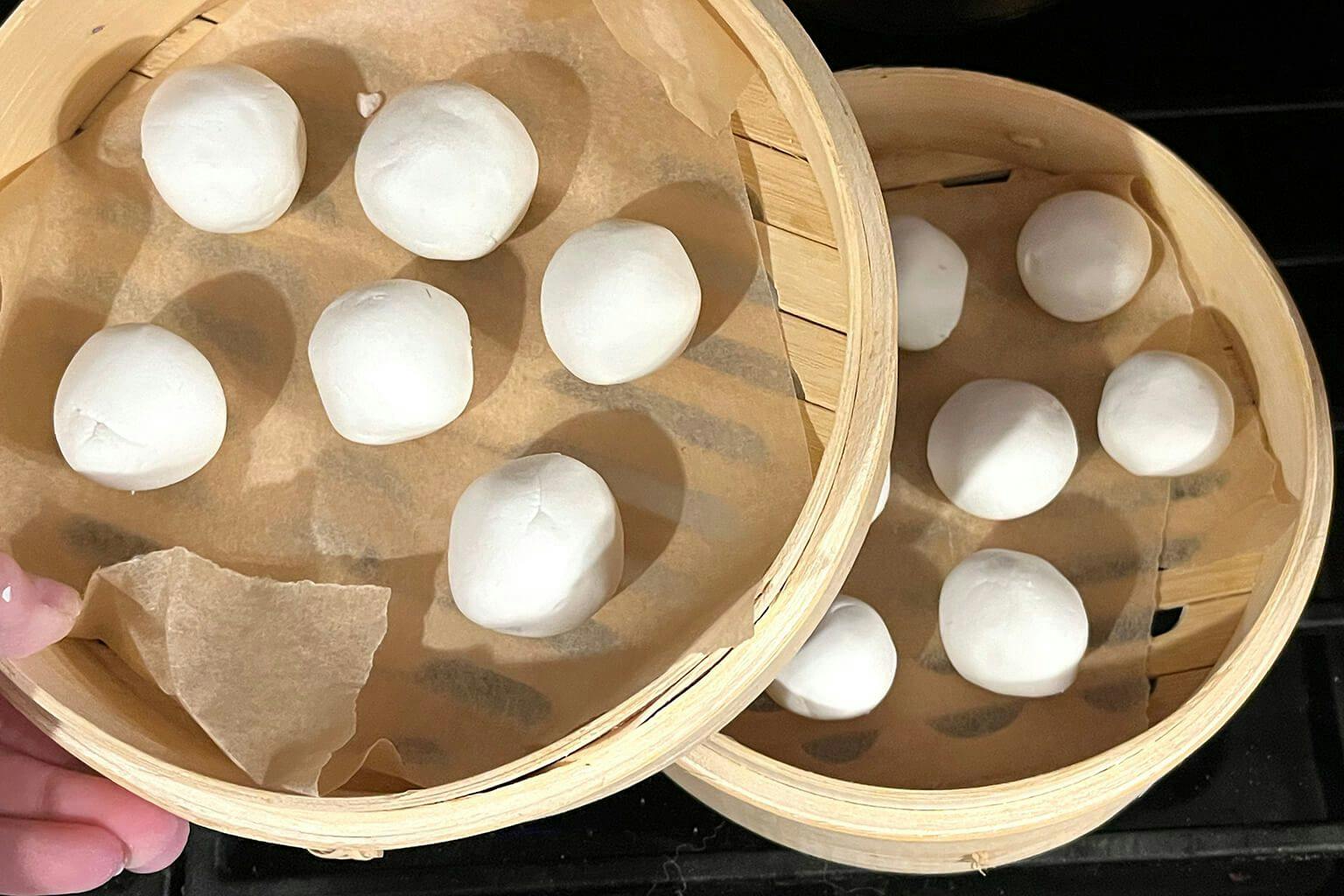 Place dango in the bamboo steamer