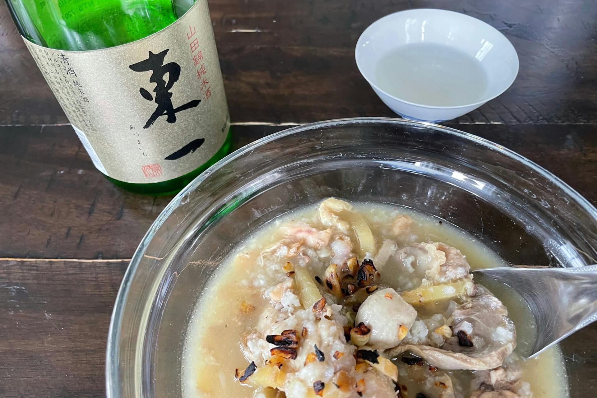 Kanzake (warm sake) with a type of rice porridge with chicken