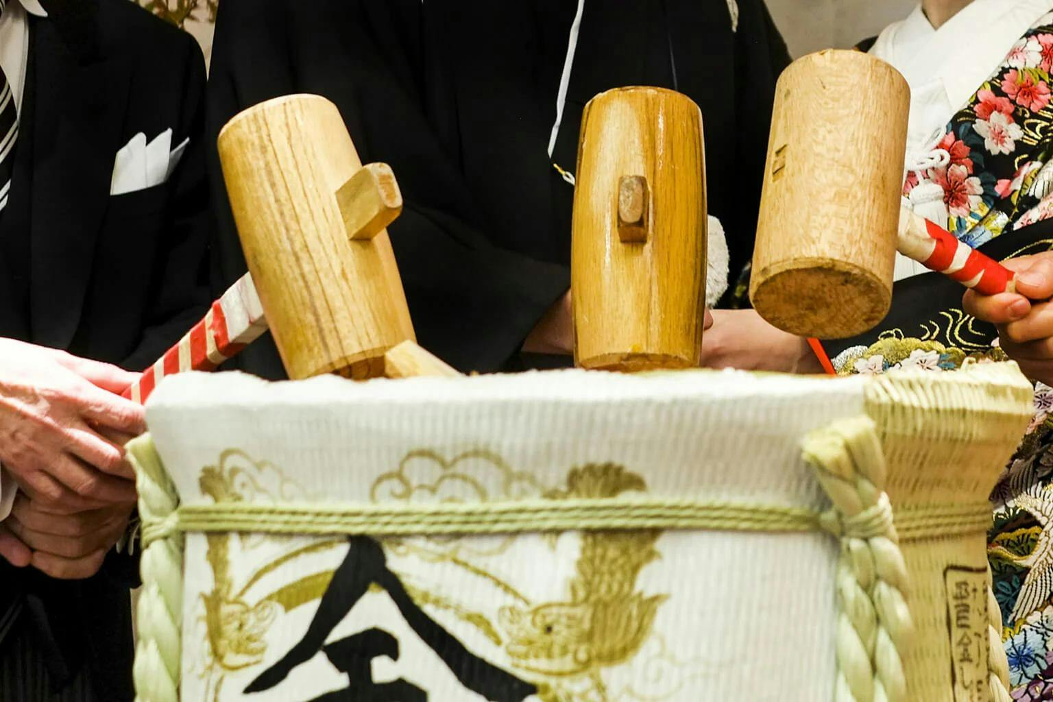 Wooden mallets are set to strike a sake cask at a wedding as part of kagami biraki.