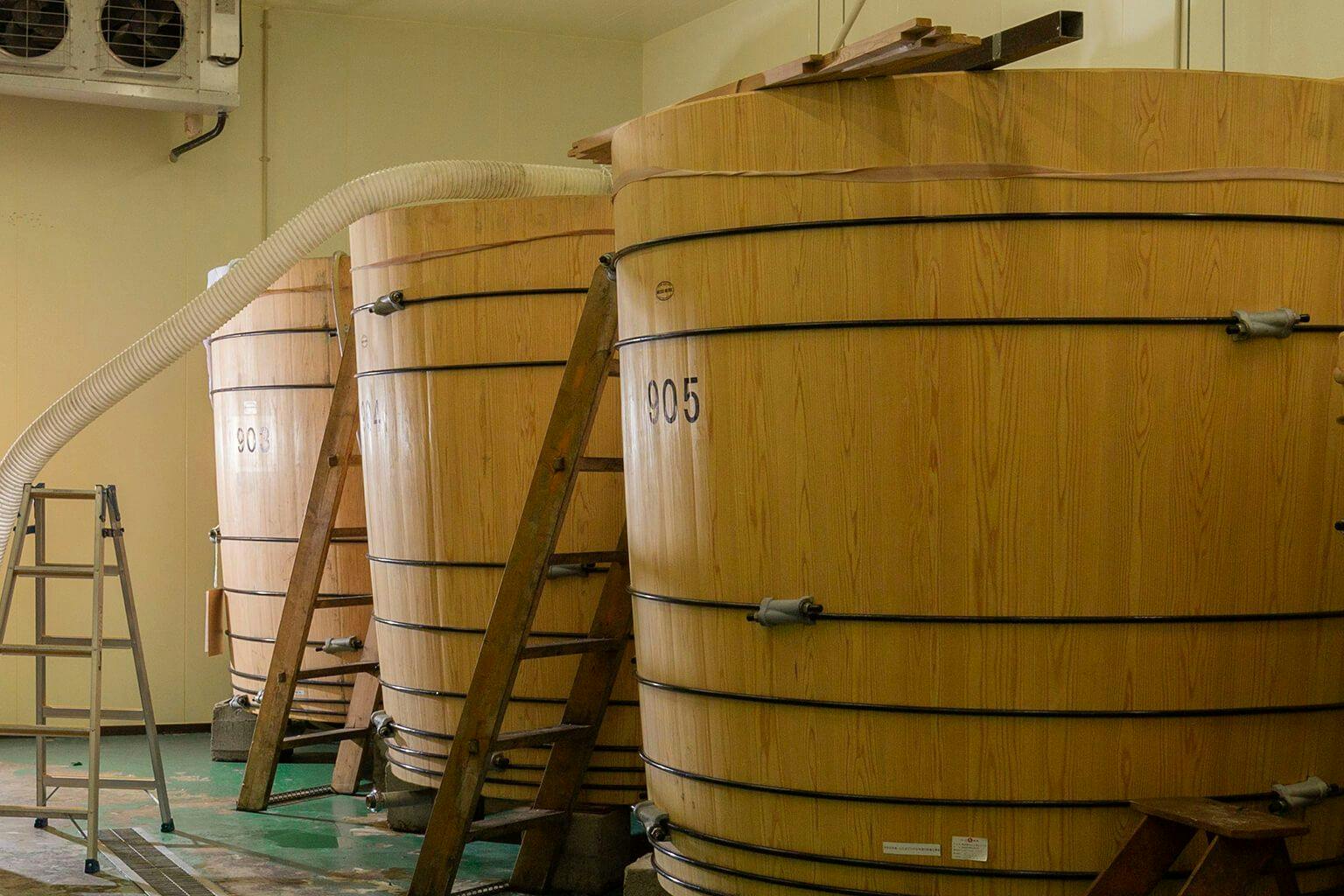 Three large wooden tanks at Ninki Brewing Company