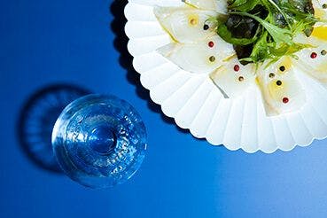 Cold, clean, delicate sake tends to pair well with dishes that possess similar qualities, like white fish carpaccio