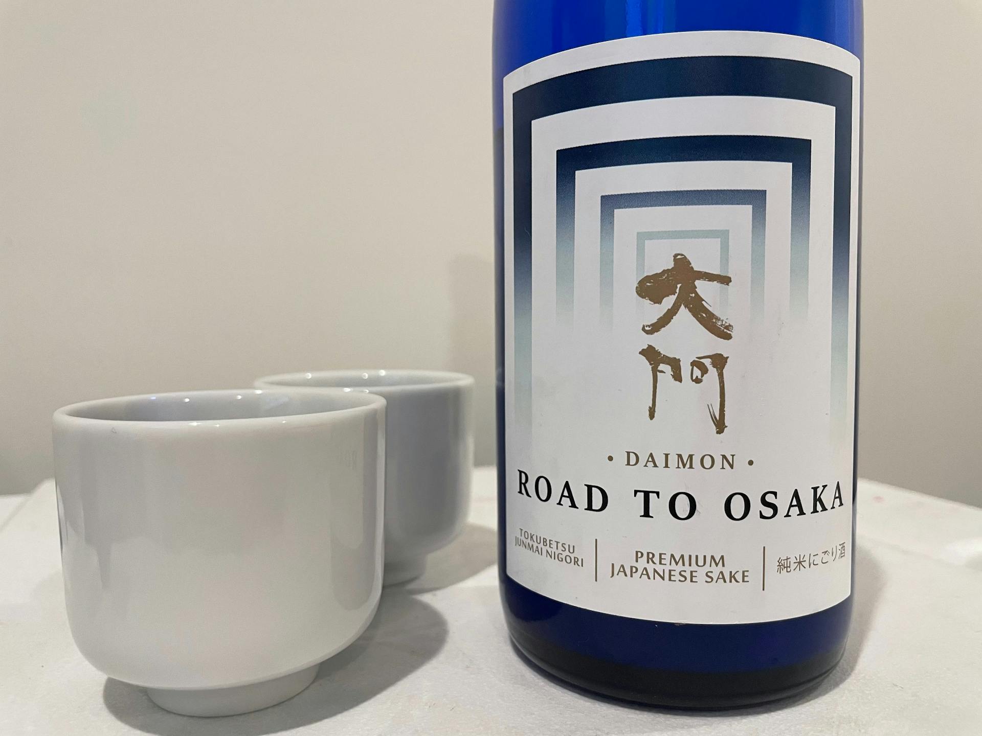 Bottle of Daimon Road to Osaka and sake cups