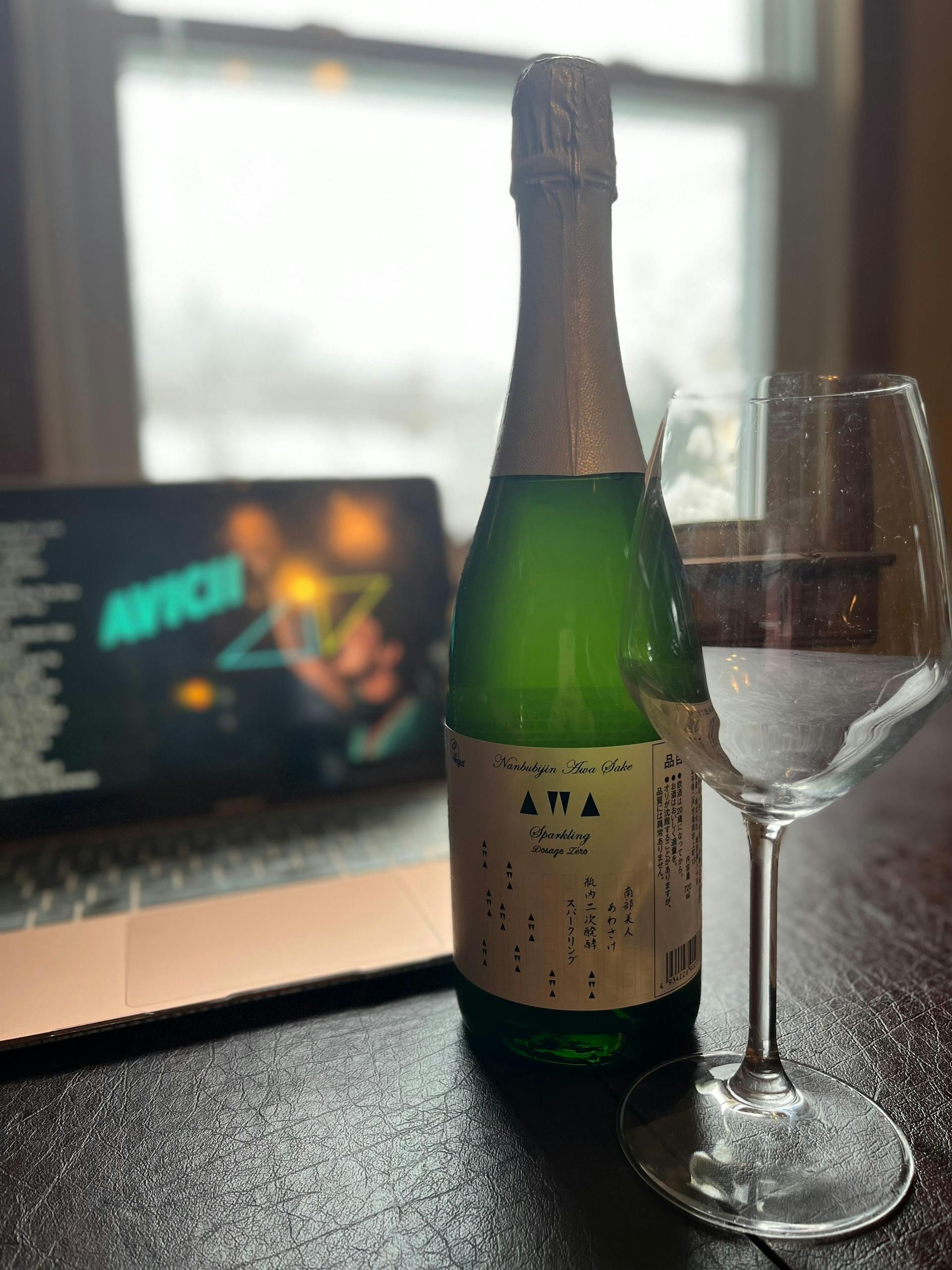 Nanbu Bijin “AWA Sparkling” in front of laptop streaming songs by Avicii via YouTube. Song playing: “Levels.”