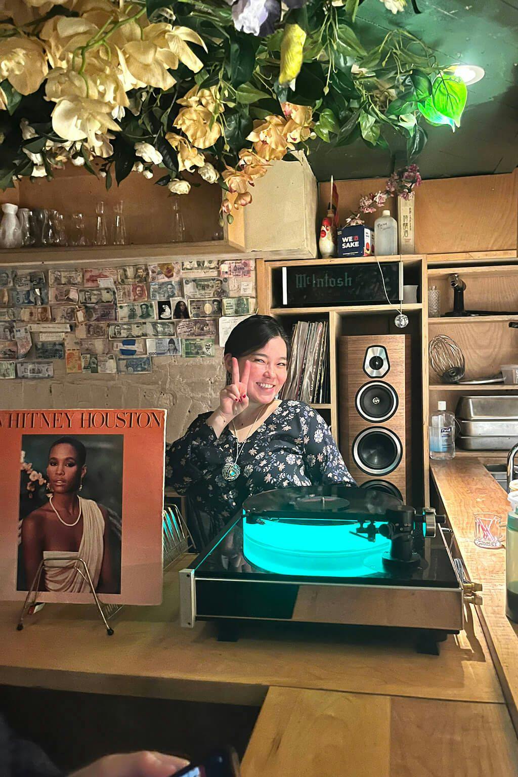 Miss Sake USA Jessica Joly spins a Whitney Houston vinyl record