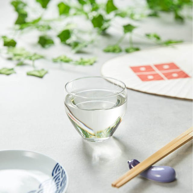“Aderia” Craft Sake Glass Mellow, on a table