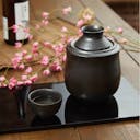Black Sake Set With Warmer, on a table