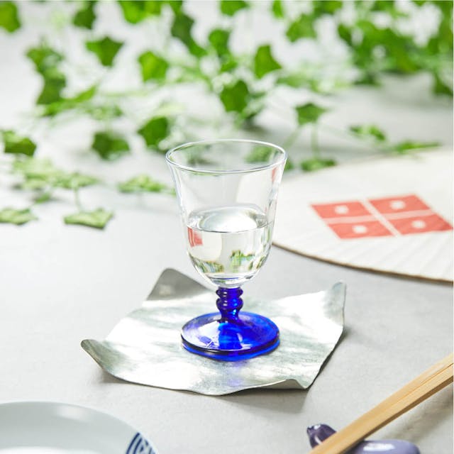 Cold Sake Glass With Blue Mini Stem, on a table
