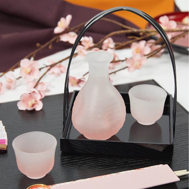 “Fubuki” Sake Set With Handbasket (Pink), on a table