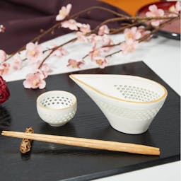 Hotarude With Mica Gold Rim Sake Set, on a table.