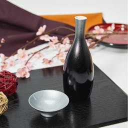 Porcelain With Black and Silver Urushi Lacquer Sake Set, on a table