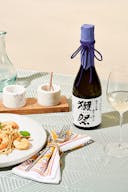 Dassai “23” Junmai Daiginjo with a wine glass, served withcreamy shrimp pasta