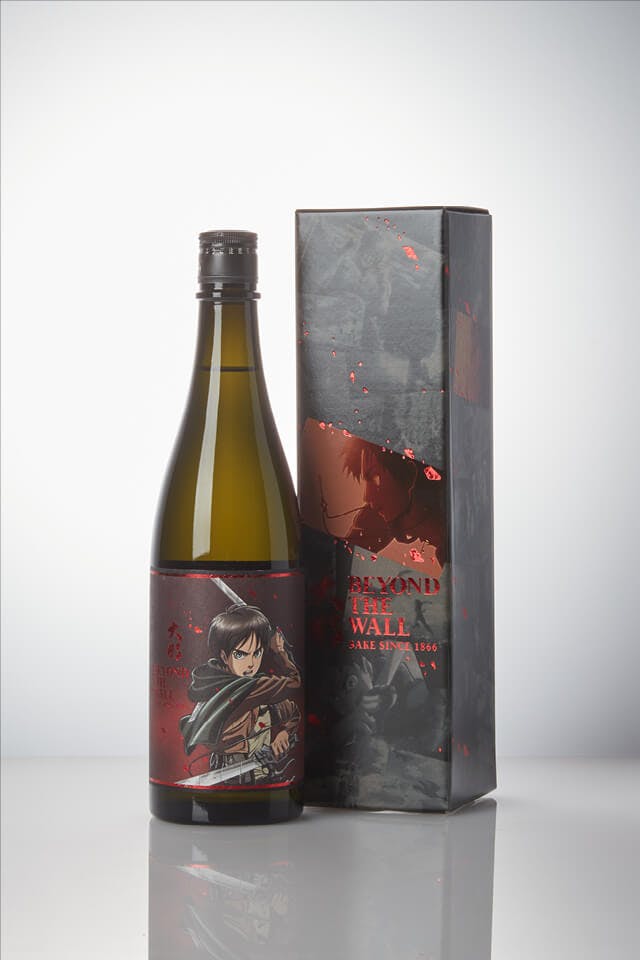 Daina “Beyond the Wall” Eren Label Junmai Ginjo, standing in front of a product box