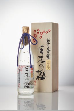 Tatsuriki “Nihon no Sakura Gold” Junmai Daiginjo, standing in front of a product box