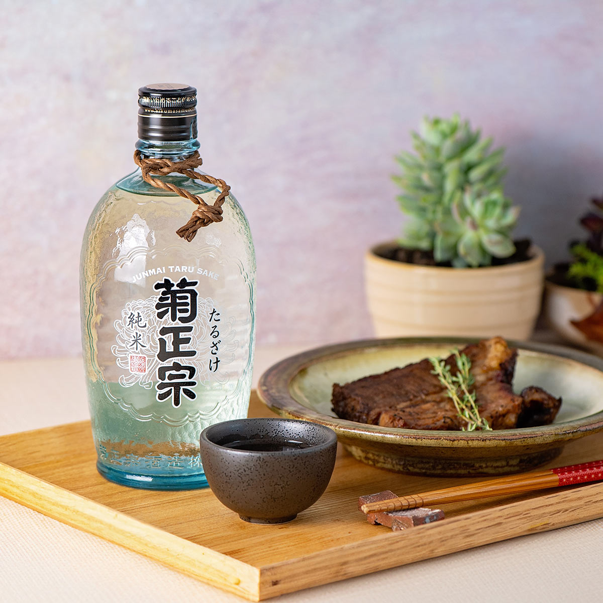 Kikumasamune “Taru” Junmai, with a ceramic guinomi cup, served with smoked beef