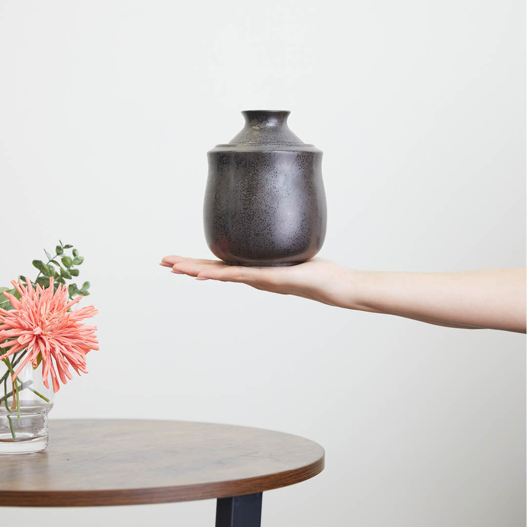 Black Tokkuri With Warmer, on a hand